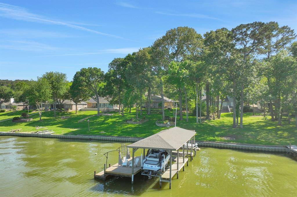 Situated on a 0.6283 acre waterfront lot complete with steel bulkhead and boathouse