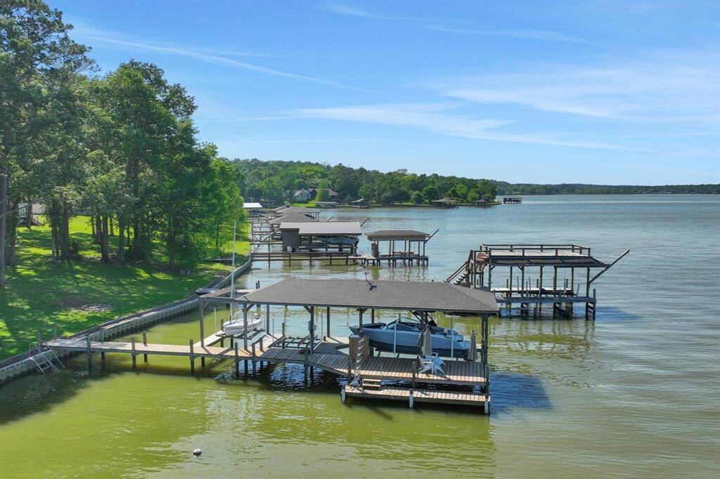 The boathouse has a boat lift, jet ski lifts and sailboat lift