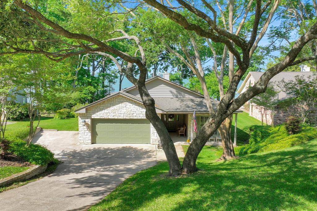 Experience lake living at its best in this beautiful home inside a gated community
