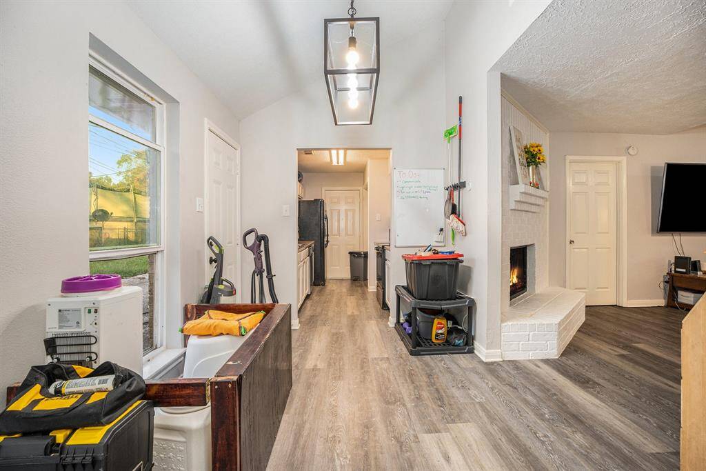 Dedicated Dining Area with fabulous flooring, upgraded modern lighting and space for meals together.