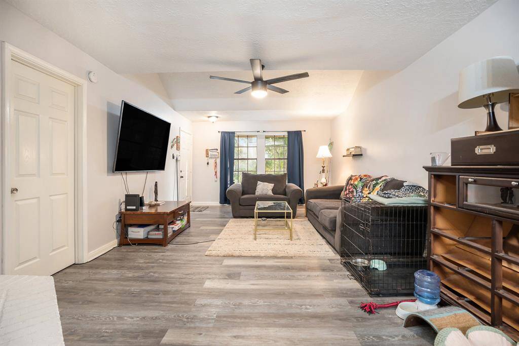 Luxurious Living Room to enjoy time with loved ones or entertaining guests with an abundance of space and natural lighting.