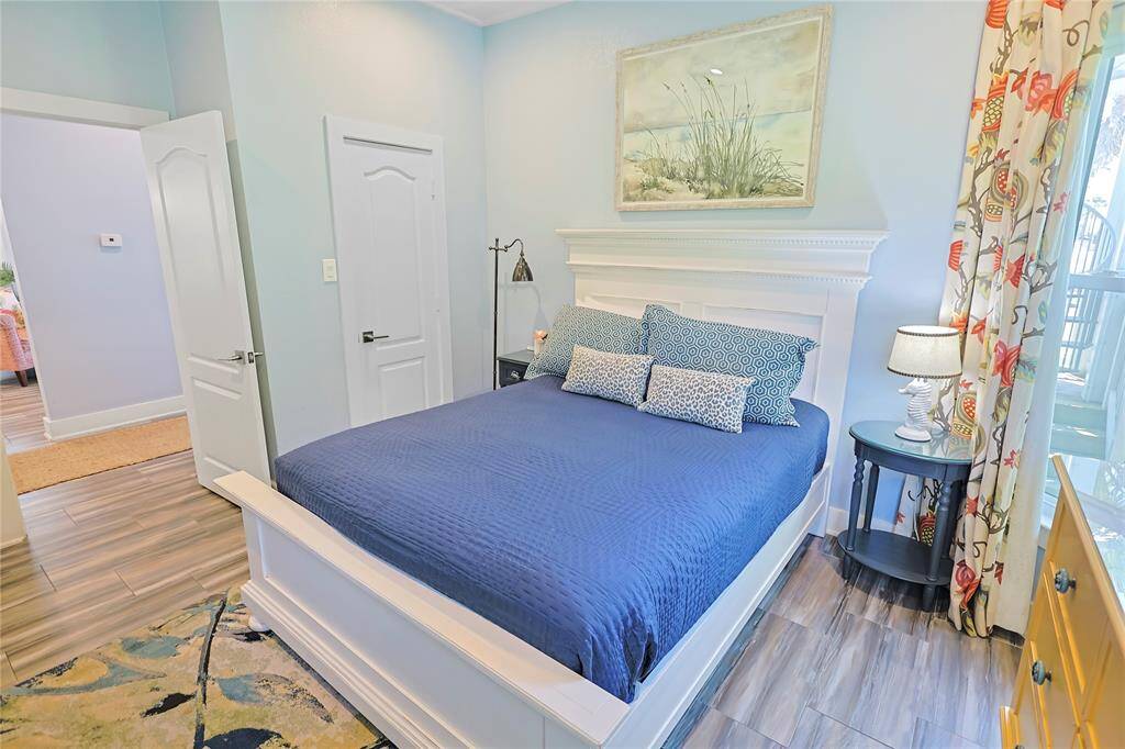Snuggle up in this cozy coastal bedroom, open the windows and let the sound of the waves soothe you.