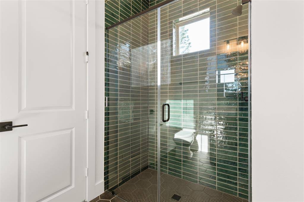 Relax in the walk in shower offered with bedroom 4.