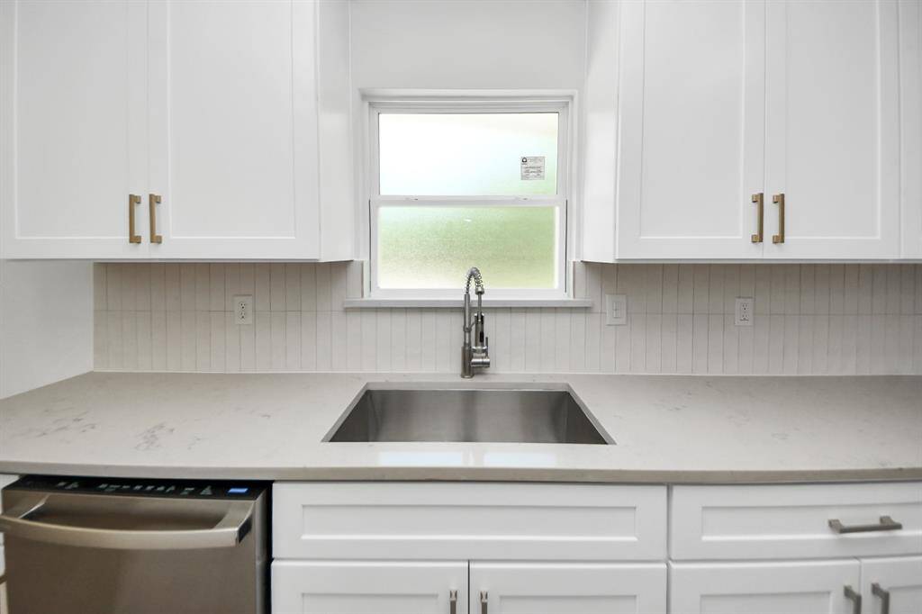 Sink looking into backyard