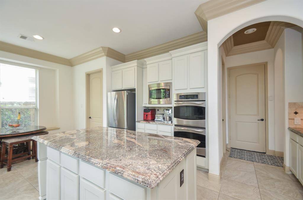 Wherever there's big kitchen counter tops, stools below are always welcomed! This island offers tremendous storage below and a huge surface for finger foods, especially when entertaining.