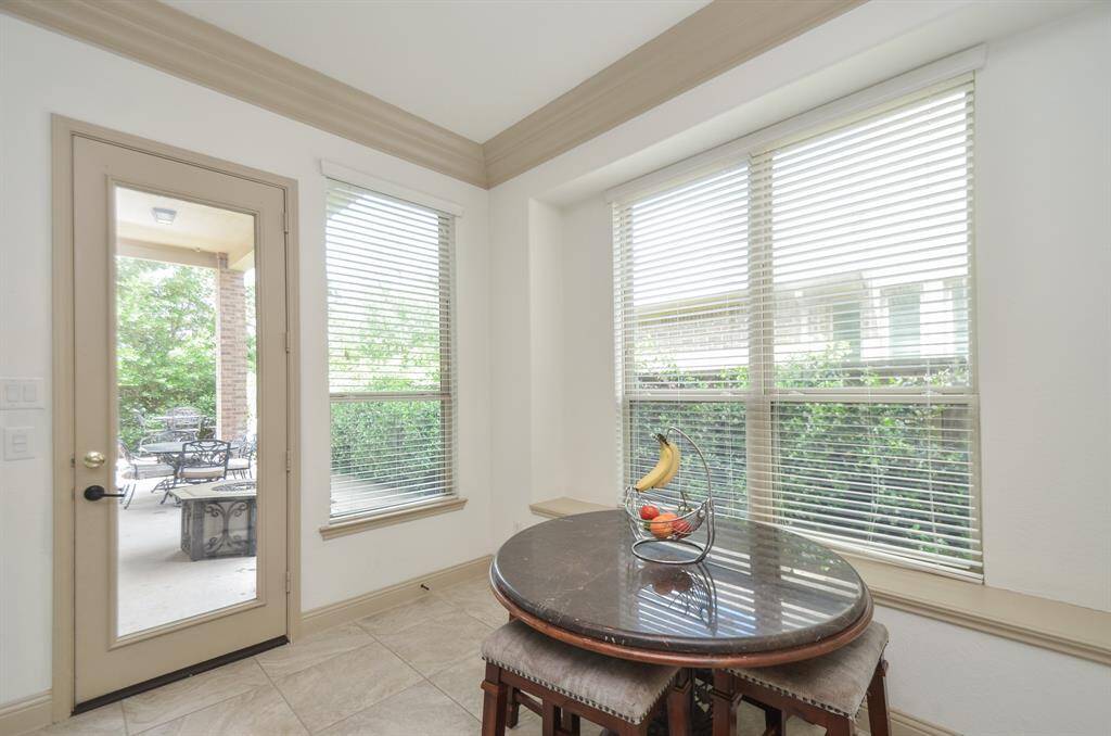 Your personal indoor life easily moves from home to covered patio, in this view of breakfast/casual dining nook, and the outdoors!