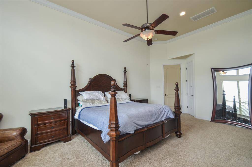 You have ample room in your primary suite for accents, too. How about a cozy reading nook, under the windows?