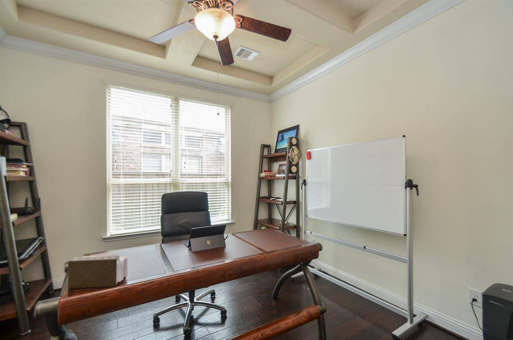 A bright computer, office, study space is an option in a secondary bedroom.