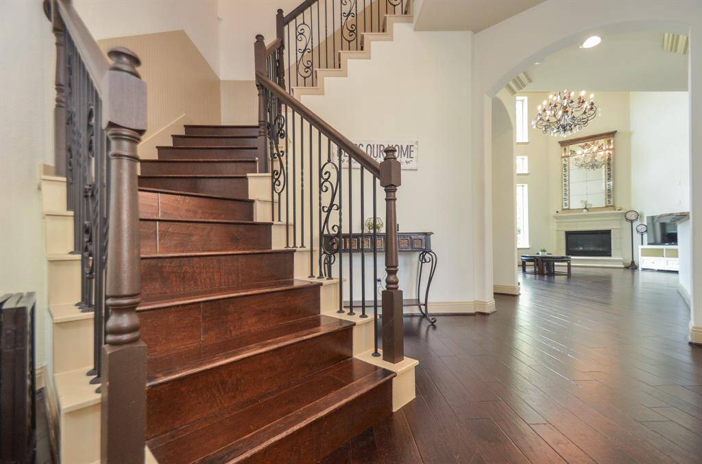 This fabulous wooden/wrought iron spiral staircase is a work of art, in itself, just off the front entry.