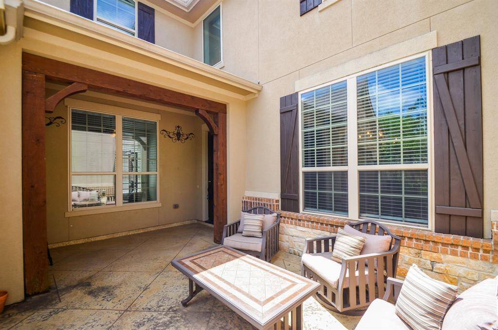 This delightful patio/courtyard offers a simple outdoor retreat.