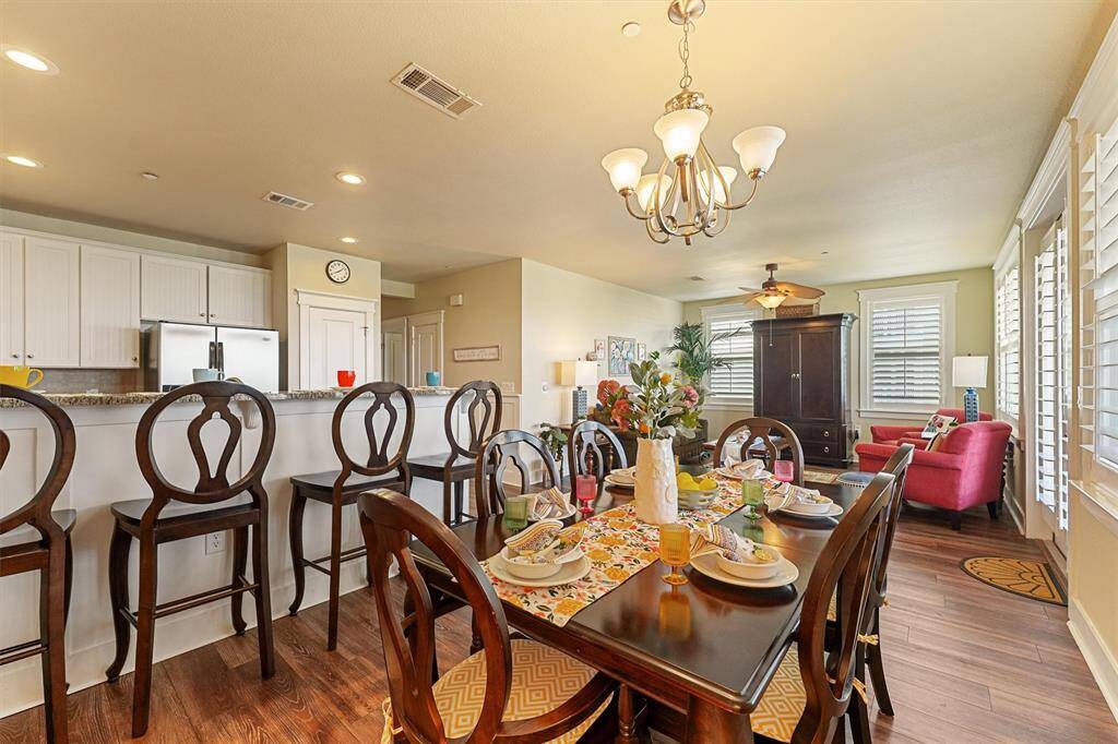 This open dining area offers plenty of room to gather, with seating for six and a seamless flow into the living room and kitchen—perfect for entertaining or casual meals.