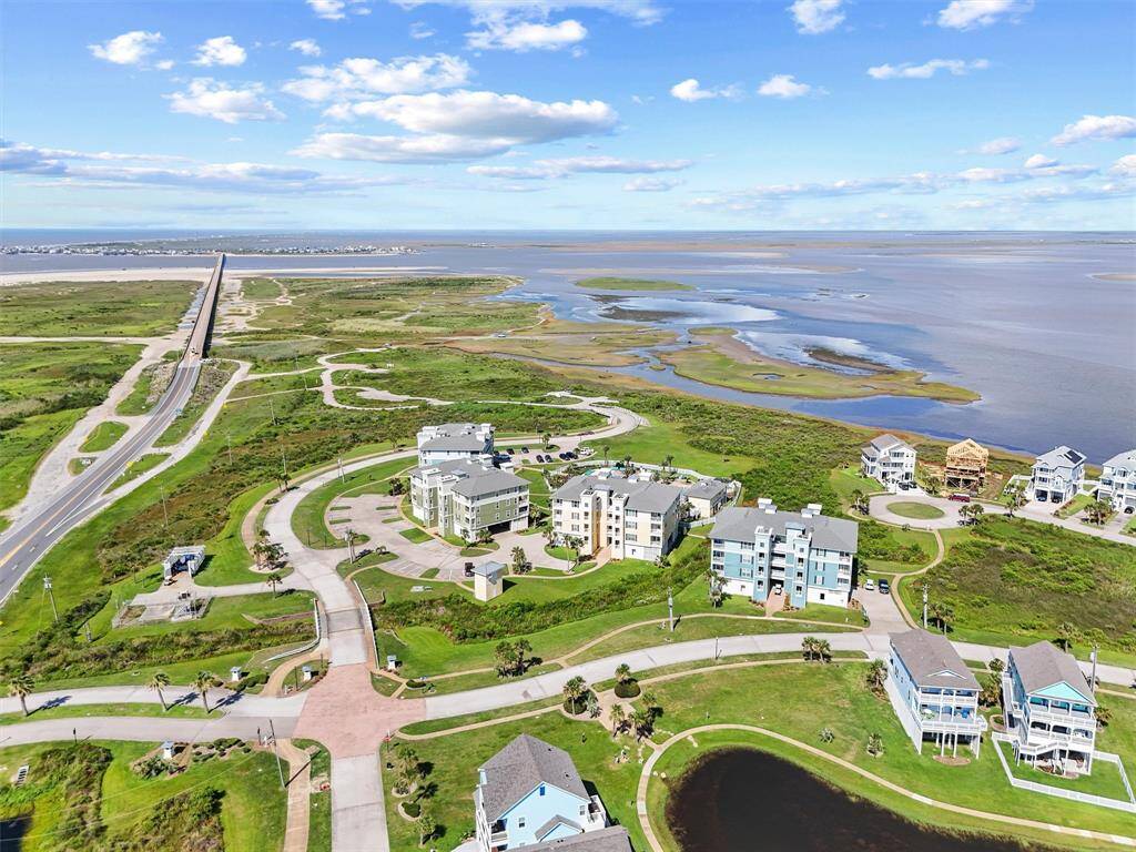 Enjoy peaceful surroundings in Galveston's sought-after Pointe West community, with panoramic views of the bay, coastal preserves, and wetlands.