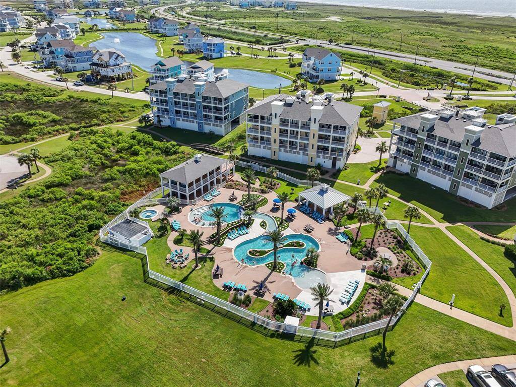 This exclusive amenity center features a lazy river-style pool, spa, shaded pavilion, grills, and lounge areas for sun-soaked days with friends.