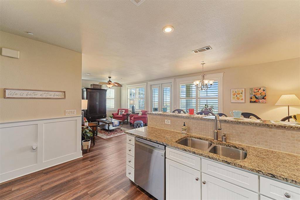 Whether you're prepping meals or hosting guests, this open-concept kitchen keeps you connected to the living and dining areas beyond.