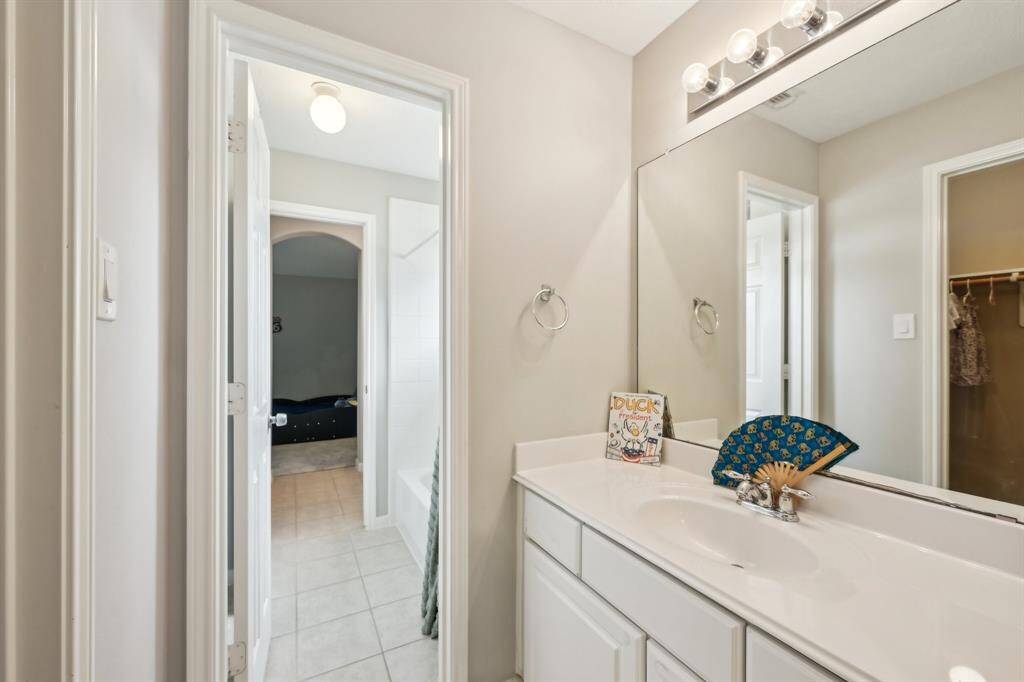 Jack and Jill bath for bedrooms 3 & 4, each have with private closet and vanity