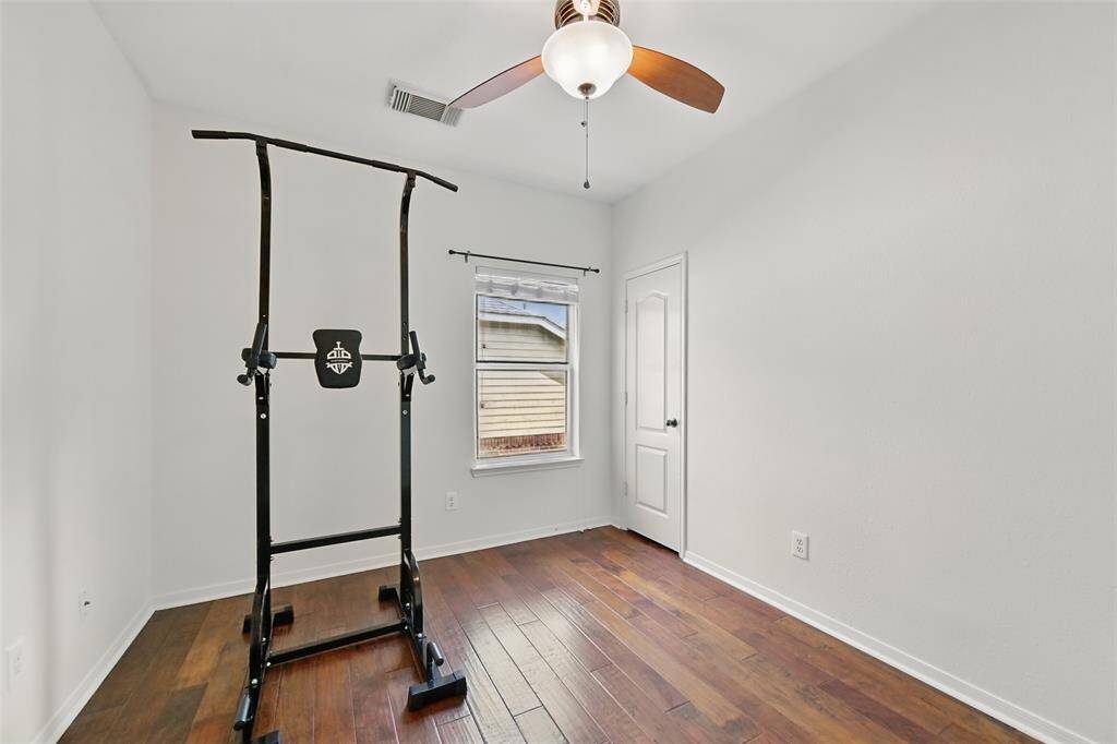 Bedroom number two has a ceiling fan with light fixture.