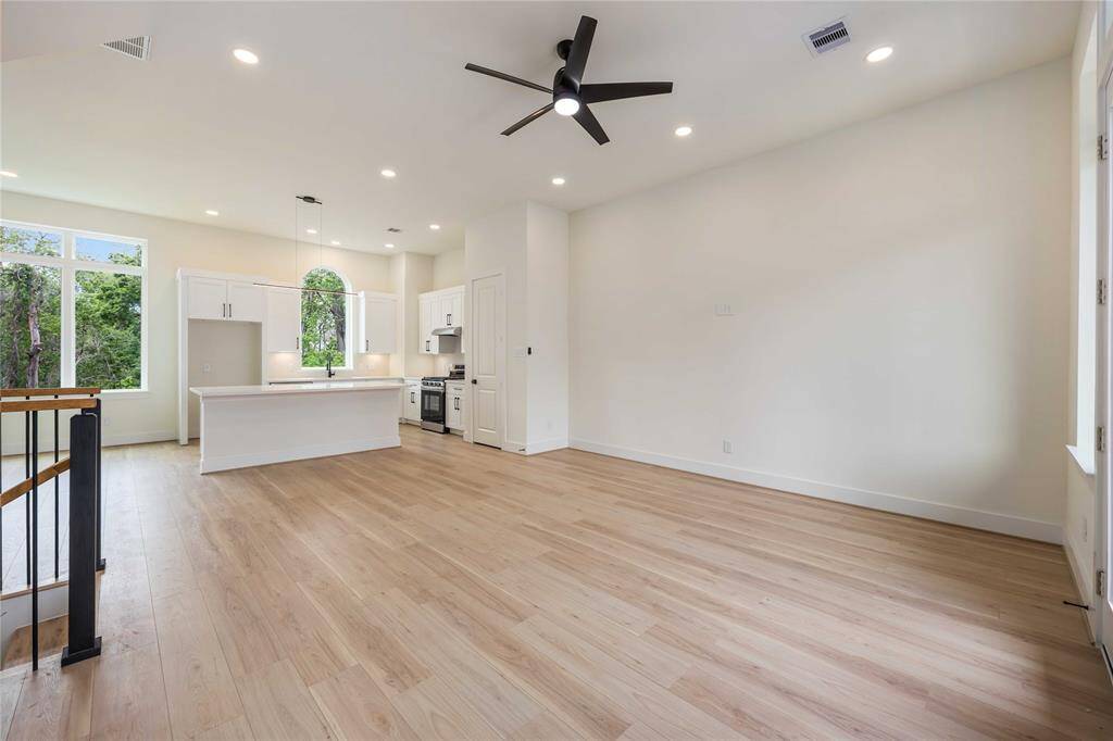 From the living room, you'll catch your first glimpse into a stunning island kitchen.