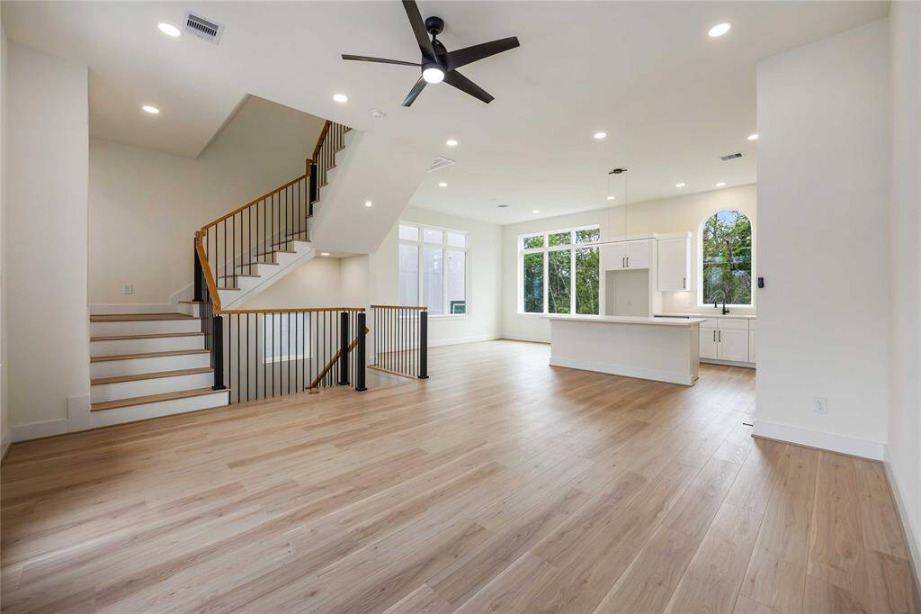 Enjoy this view of the kitchen and adjoining dining area. This side of the island offers a breakfast bar as well for additional seating.