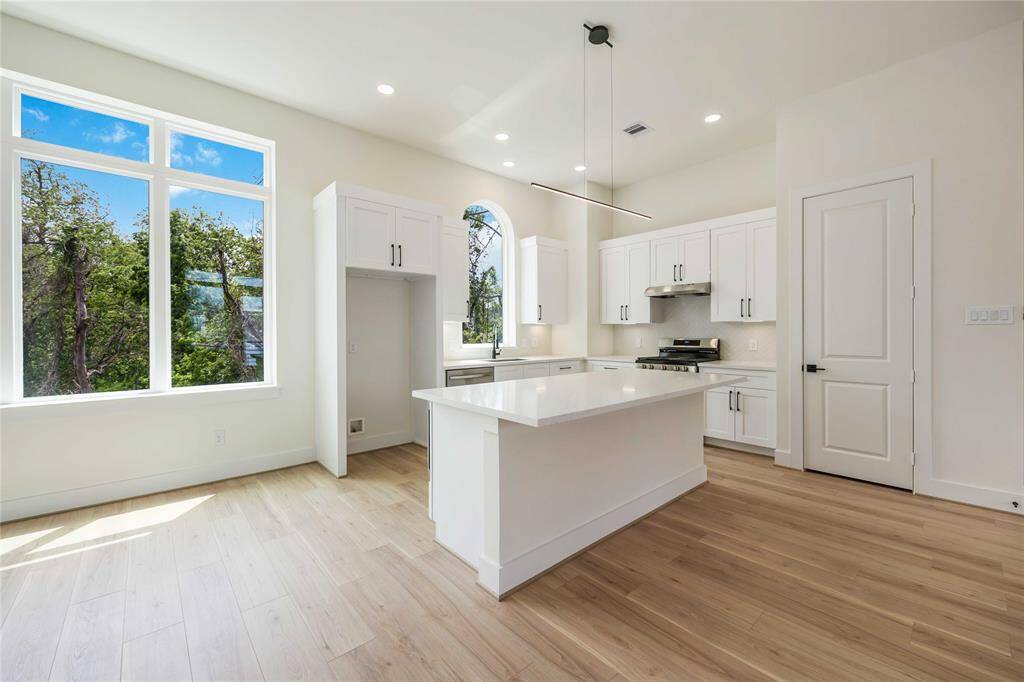 The kitchen provides plenty of counter space and cabinetry as well as a pantry for all your kitchen storage needs.