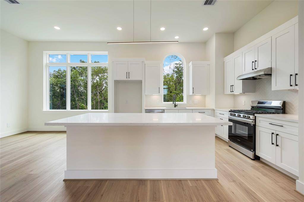 Add a few barstools for casual dining or set up snacks and beverages on the island around which family and friends can gather at your next get-together.