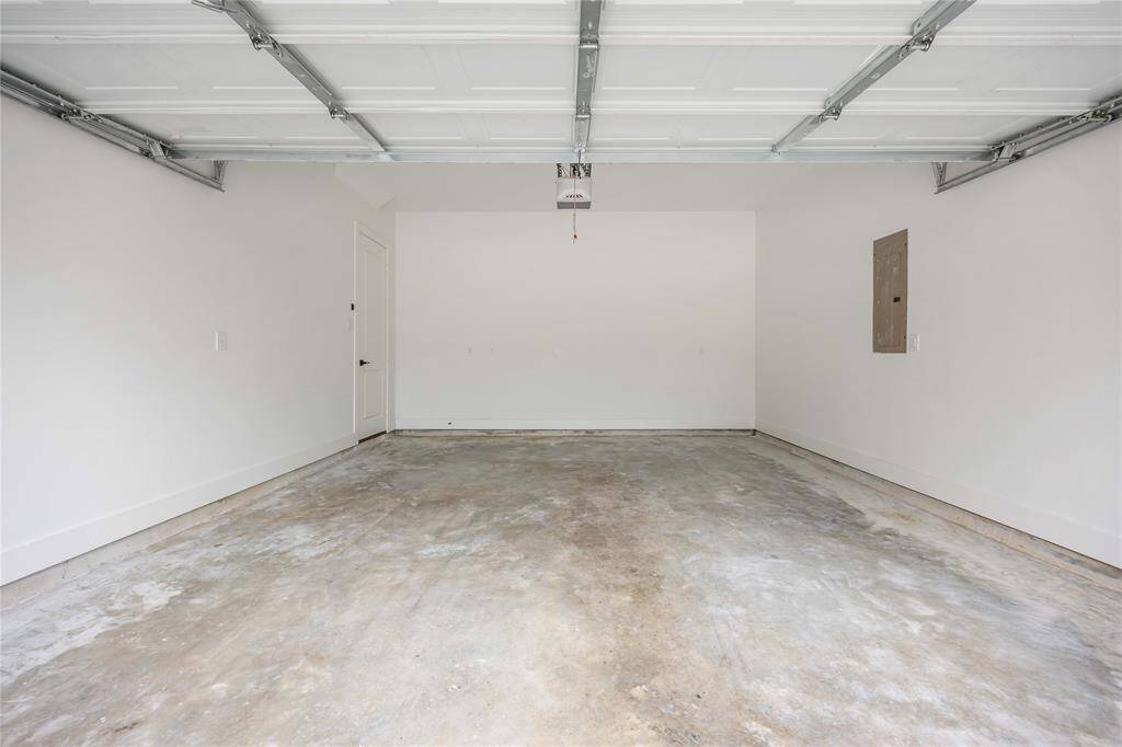 The 2-car garage shows the private entry to the home on the left.