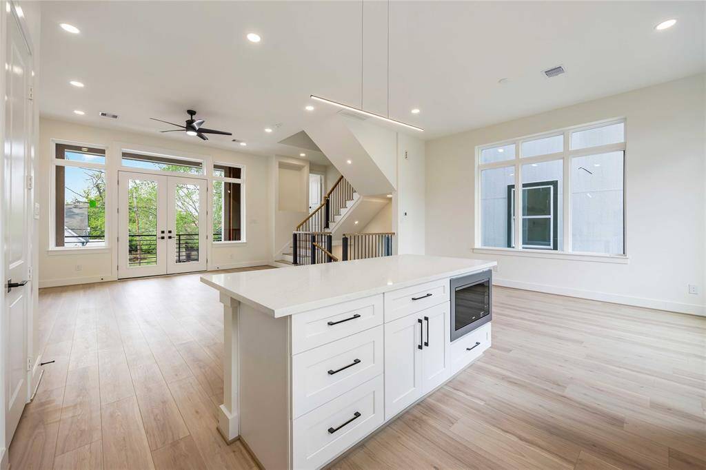 This ideal island kitchen boasts a quartz counter top. This open floor plan lends itself to entertaining.