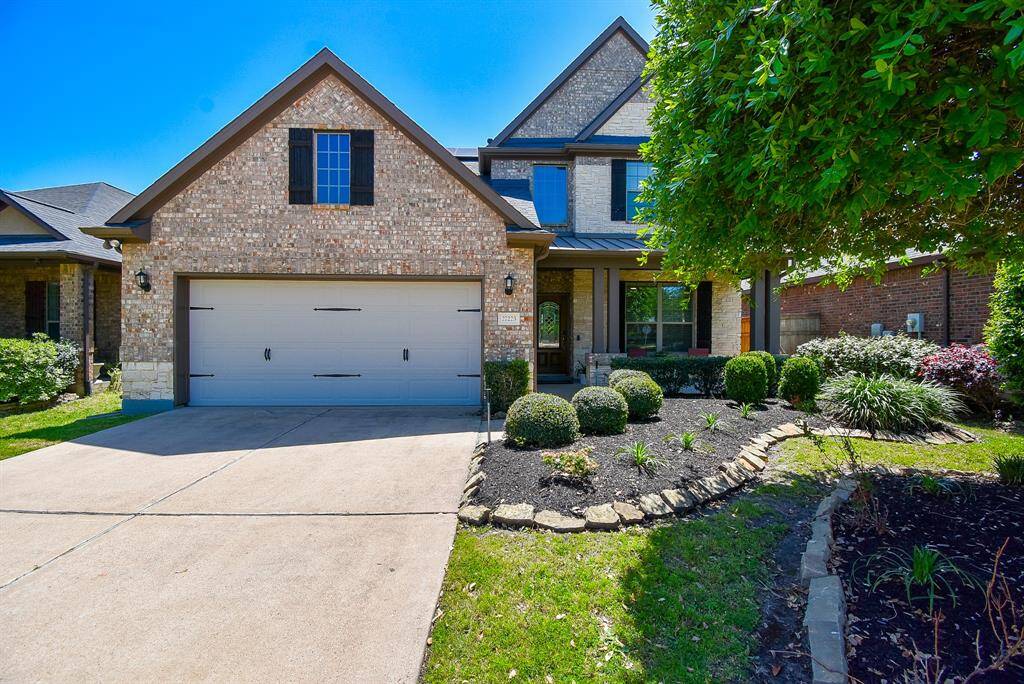 Just pull right into this good looking attached dual car garage at 27223 Buffalo Lane, Fulshear, TX, in the master planned Cross Creek Ranch community.