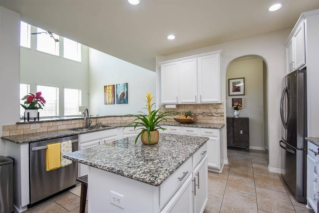 Picture yourself popping open that saved bottle of champagne at the sink, while family and friends cheer you on from the living area!