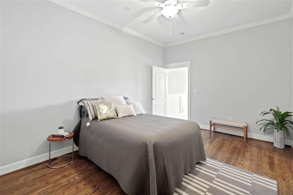 Large primary bedroom is spacious enough for a large bed and small sitting area