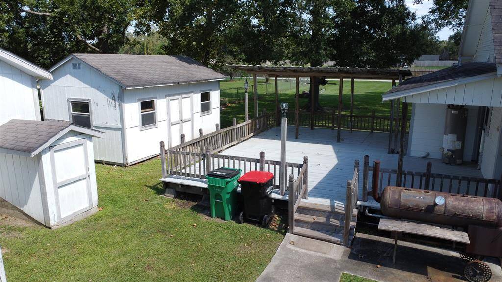The small building to the left is the storm cellar - thats a GREAT thing to have!