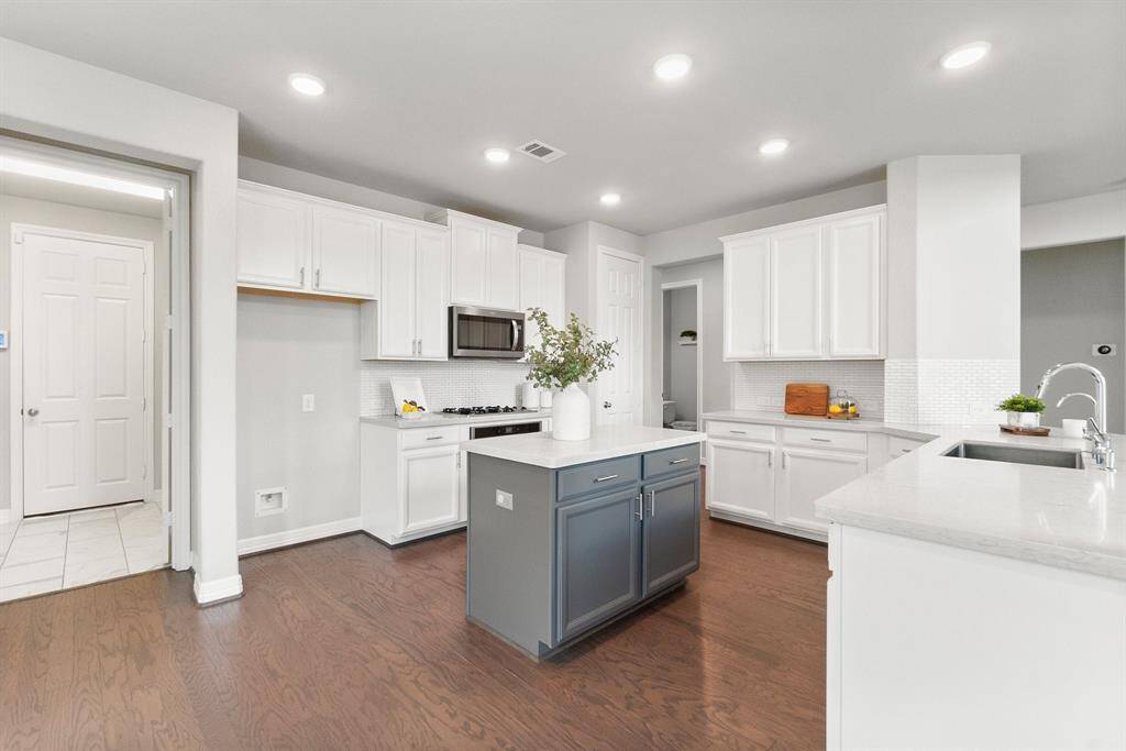 The spacious laundry room and convenient garage access are located just off the kitchen