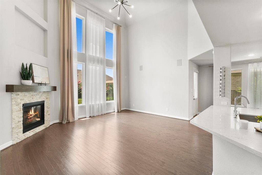 Gleaming wood floors flow throughout the downstairs living area