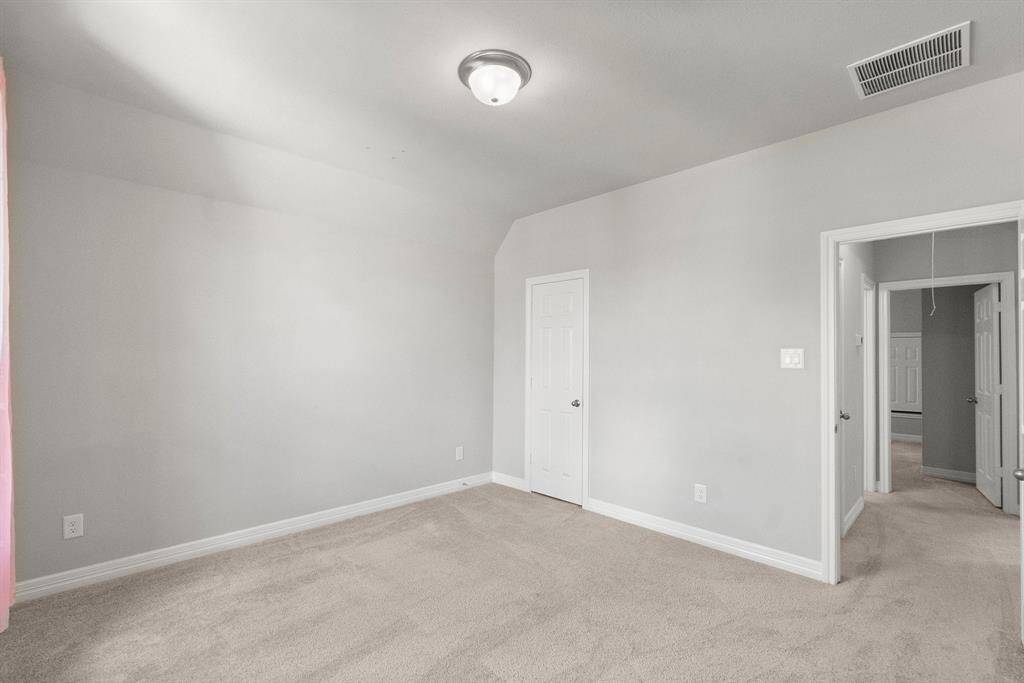 Secondary bedroom number two features a walk-in closet