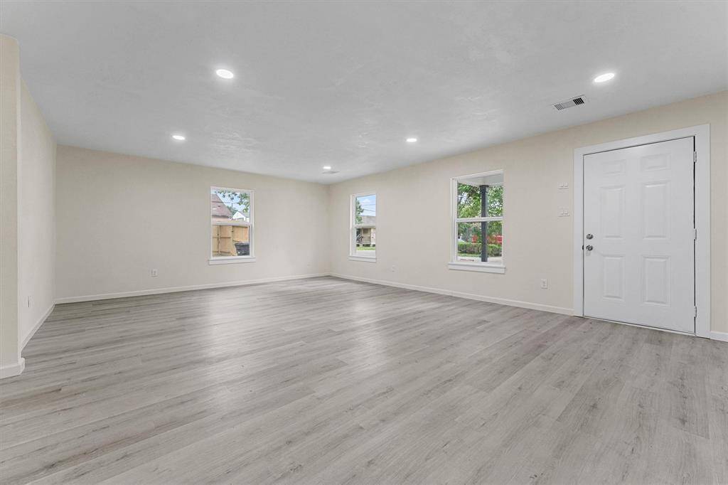 looking from the dinning area to the family room/front door