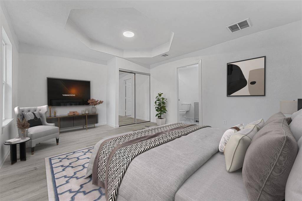 virtually staged to help you imagine yourself in this spacious primary room
