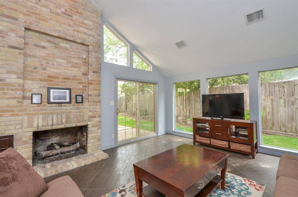 The fireplace has gas logs for instant ambience.