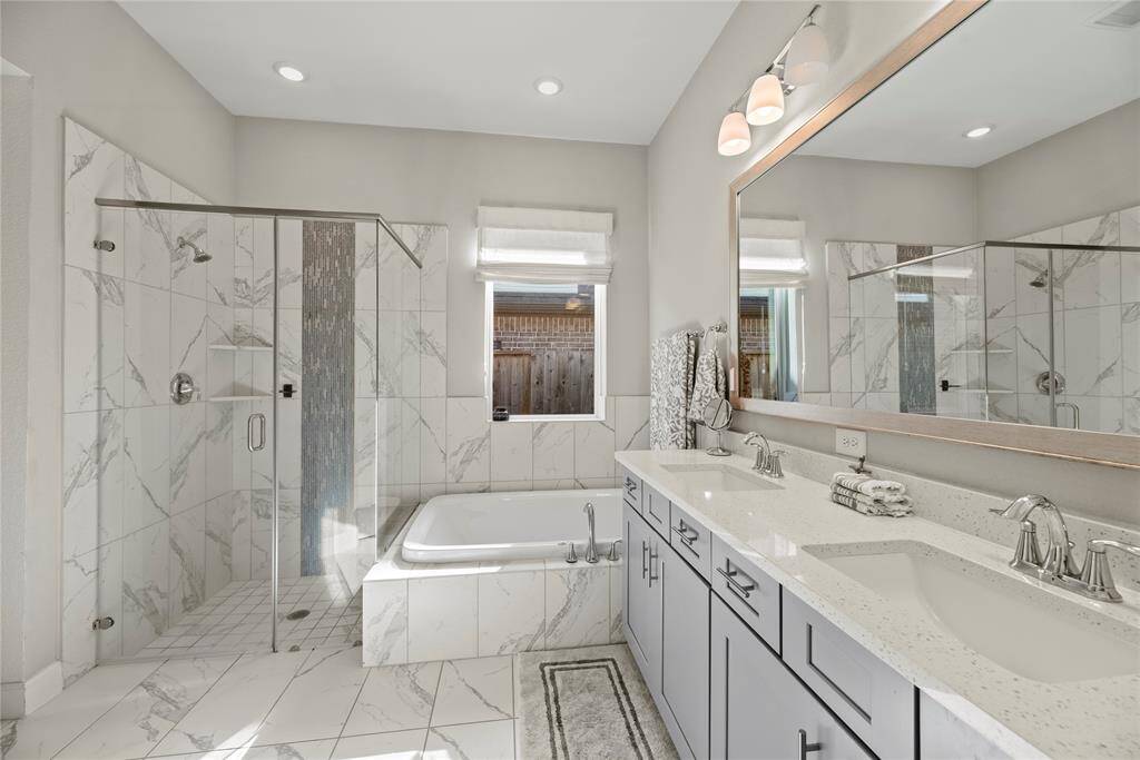 Dual vanities in your primary bath, offer personal space with tons of dedicated cabinet space.