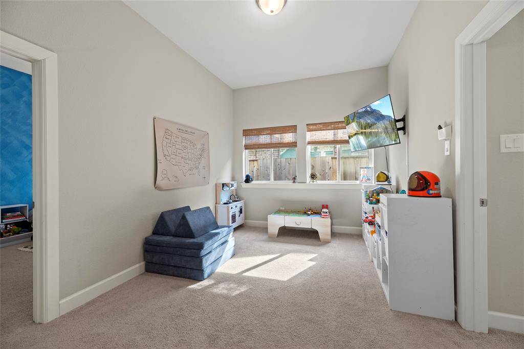 The whole family will love this game room.  This is a versatile space perfect for family fun, playtime or movie nights.