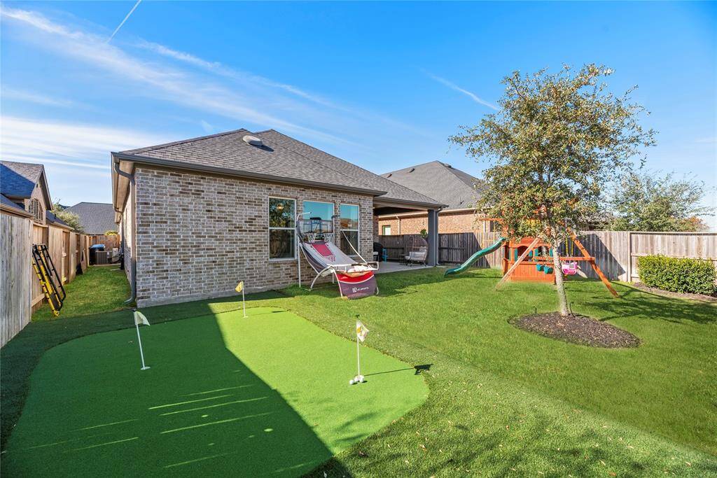 Enjoy your own private putting green with artificial turf.