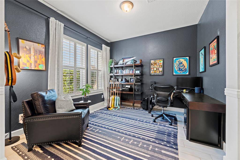 A private study to the left of the entry adds a touch of sophistication and privacy to the home. It suggests a space dedicated to concentration, creativity, and productivity.