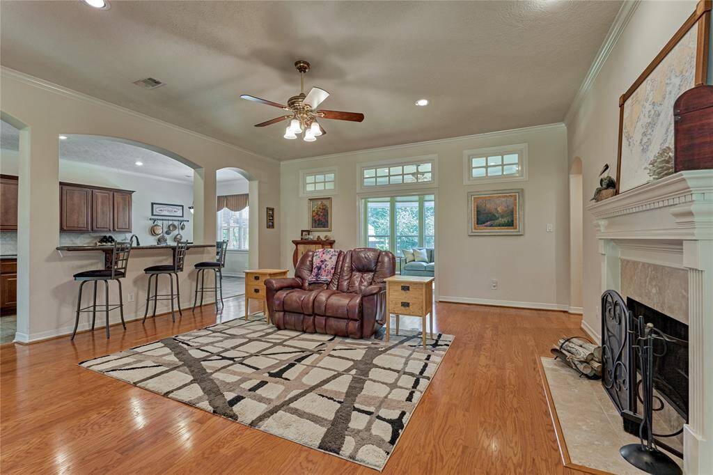 The primary living space features a gas log fireplace, making it an ideal setting for entertaining.