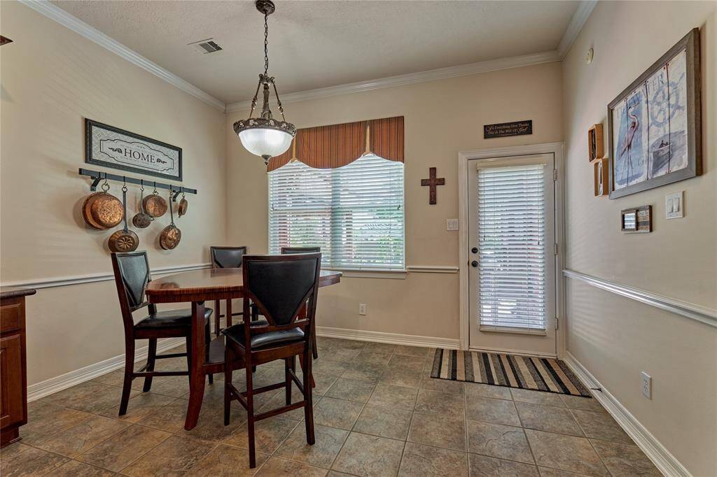 The bright breakfast room overlooks the pool.