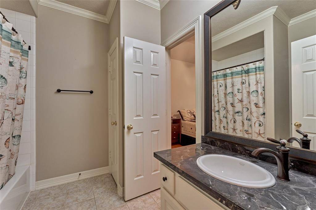 The full bathroom that serves the secondary bedrooms.
