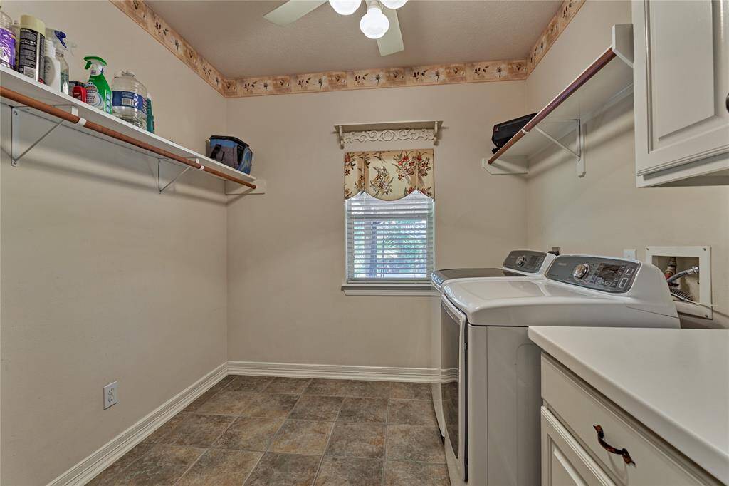 Look at the size of this laundry room with a view of the backyard.
