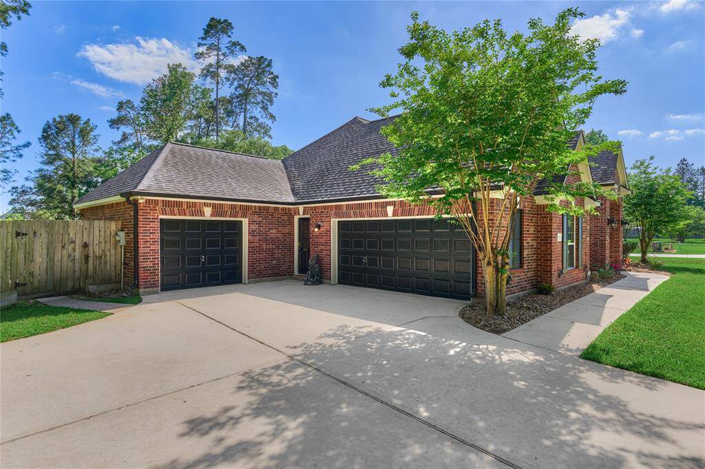 This home features a three-car garage along with additional parking space.