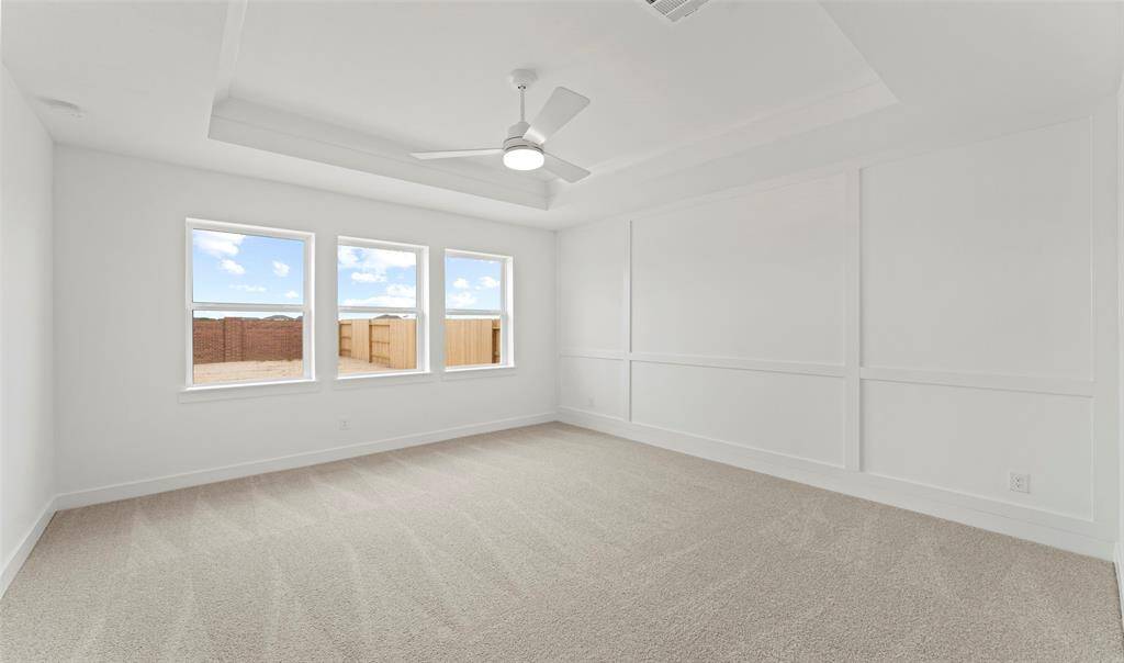 Spacious primary suite with feature wall (*Photo not of actual home and used for illustration purposes only.)