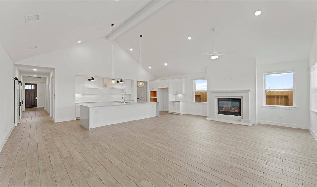 Impressive dining area and great room with fireplace (*Photo not of actual home and used for illustration purposes only.)