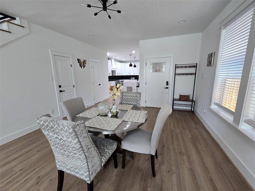 Dining area, first door on the left is half bath, and an entrance to outside walkway.