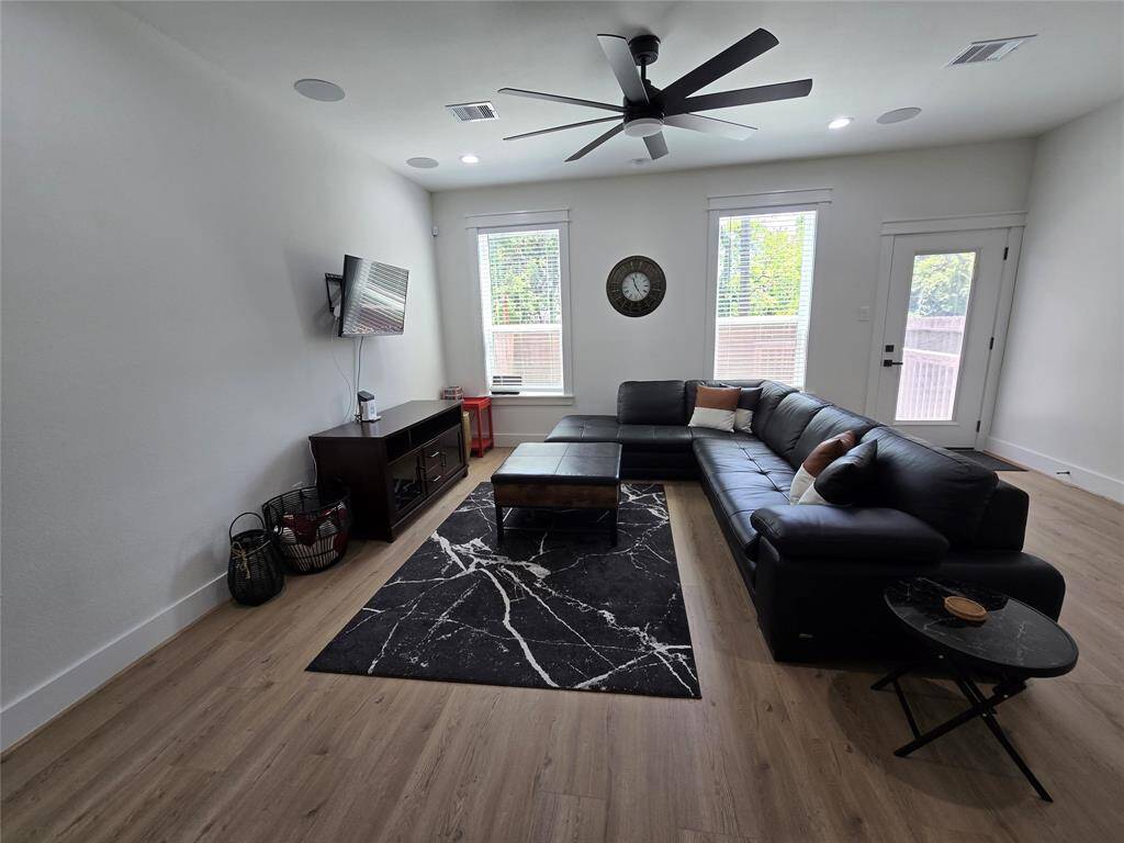 Living area, and door to the back yard and patio
