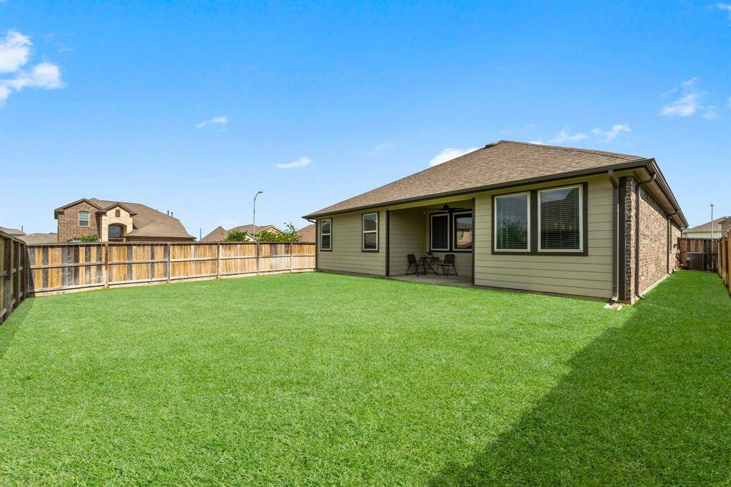 Enjoy a Nice Sized Yard on Corner Lot, Sprinkler System and Full Gutters!
